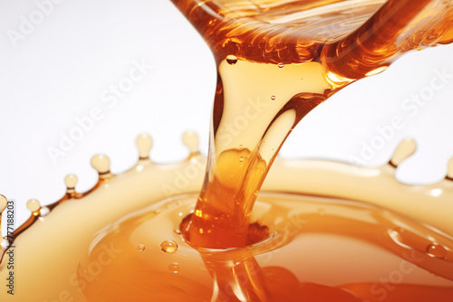 Honey pouring on white background. Mesmerizing flow of honey, a golden stream of natural sweetness. © iconogenic