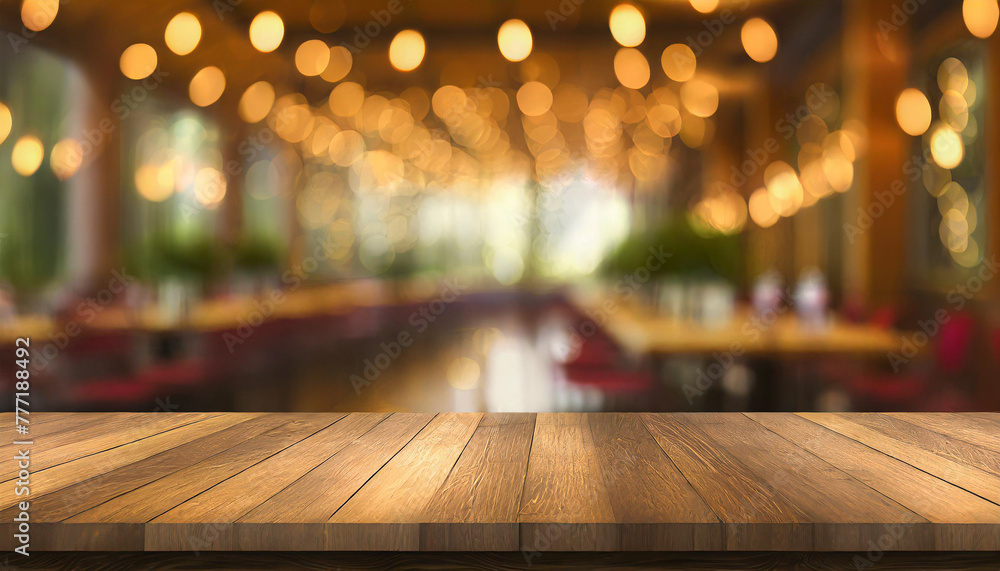 empty wood table top on blur light gold bokeh of cafe restaurant in dark background empty wood table top on blur light gold bokeh of cafe restaurant in dark background