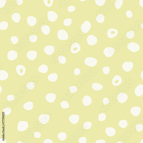 Seamless pattern with abstract dots on a yellow background.