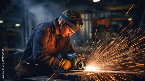 a man using grinder Cutting to cut metal in the factory