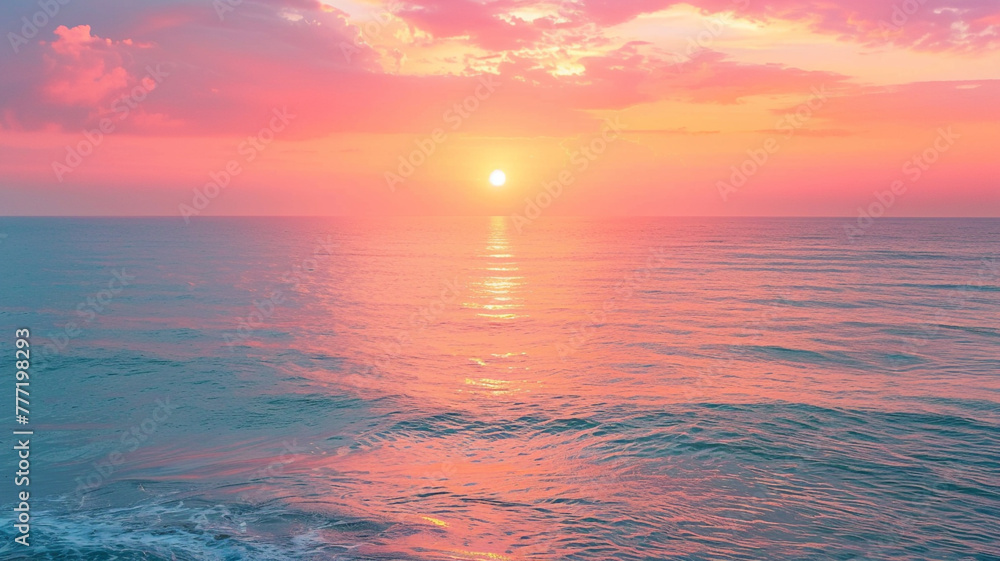 Stunning sunrise over a calm ocean, with vibrant hues of orange and pink.