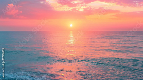 Stunning sunrise over a calm ocean  with vibrant hues of orange and pink.