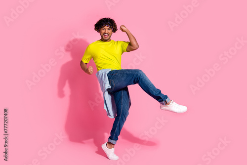 Photo of carefree glad nice man wear stylish yellow clothes shout yes hooray isolated on pink color background