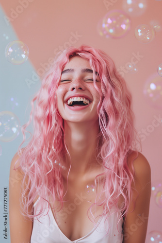 Portrait of a cute happy young girl having fun with iridescent soap bubbles flying and floating around. Concept of birthday party.