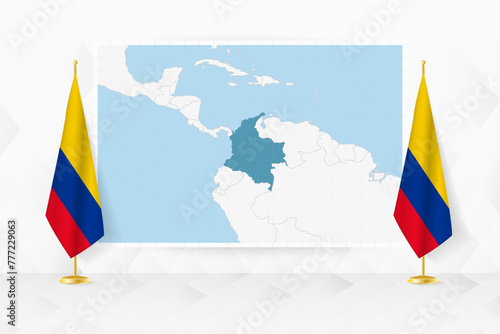 Map of Colombia and flags of Colombia on flag stand.
