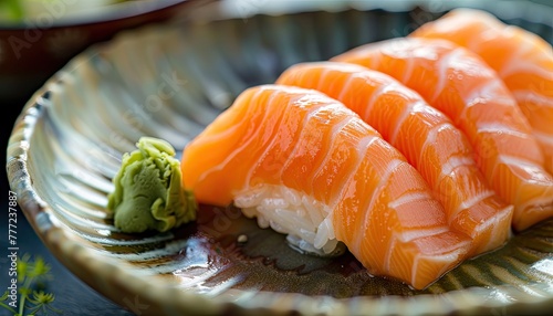 Vibrant salmon fillets ready for cooking or sushi, accompanied by a dab of wasabi on a rustic wooden table..
