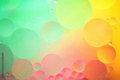 Abstract yellow, green and pink colorful background with oil on water surface. Oil drops in water abstract psychedelic, abstract image.
