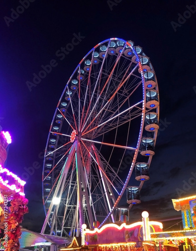 Ferris wheel at night in an amusement park 