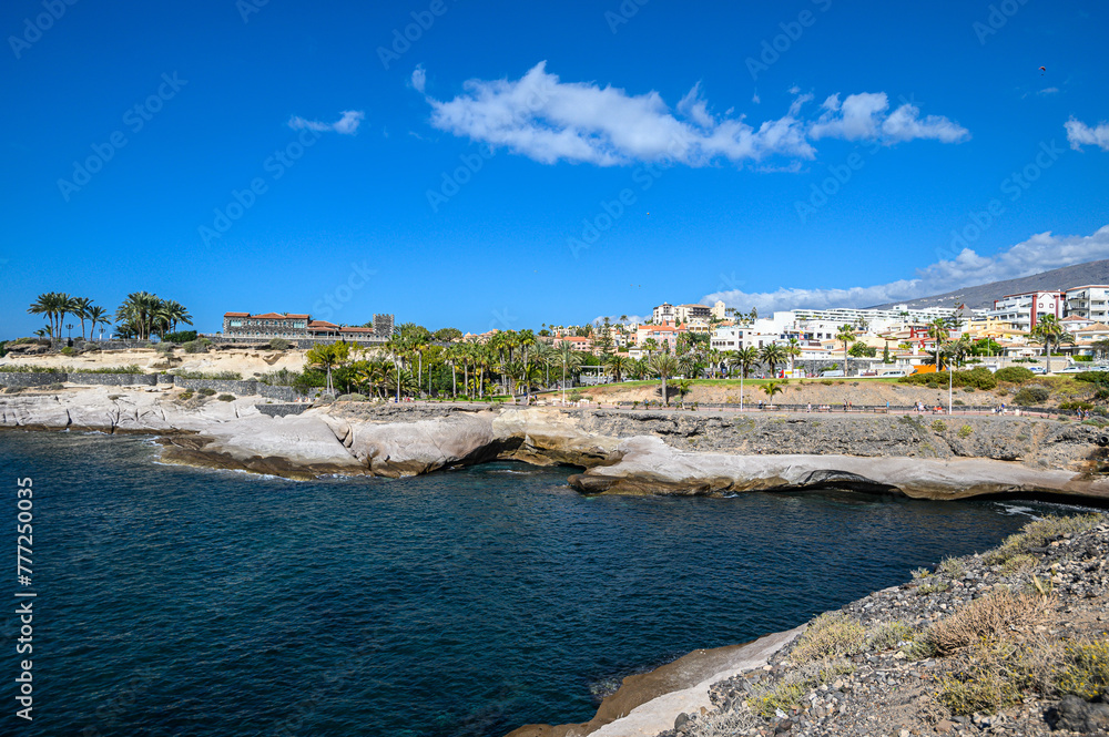 Volcanic stone coast of the city of Costa Adeje, Atlantic ocean. Tenerife, Canary Islands, Spain