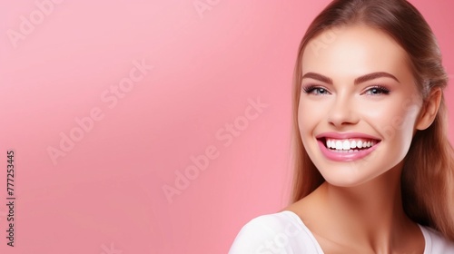 Universal photorealistic banner with a girl smiling with beautiful white teeth, close-up on a pink plain background, close-up with space to insert text