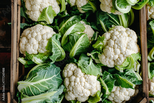 Raw cauliflower in box, top view. Vegetables in market