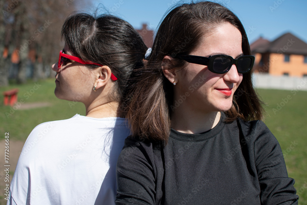 Close up portrait of a two young women in sunglasses Close up portrait of a two young women in sunglasses