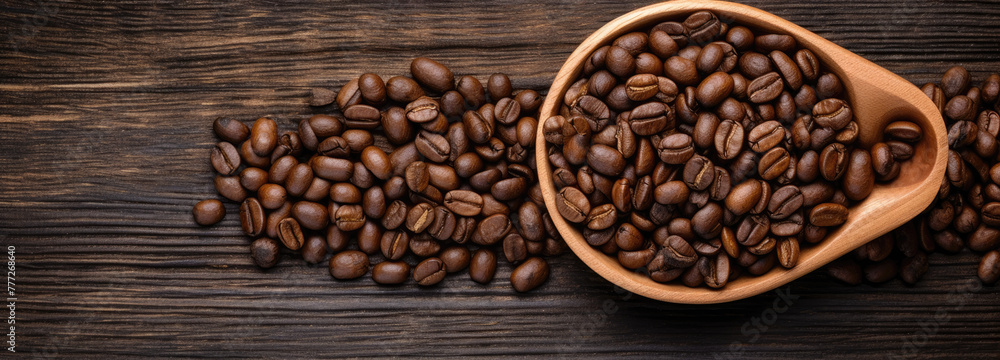 Black coffee grains lie on a brown wooden cup and wooden table, top view, flat lay Black coffee grains lie on a brown wooden cup and wooden table, top view, flat lay