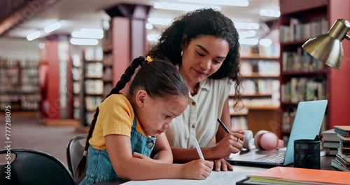 Mother, child and library for writing homework or education learning for tutor lesson, school or helping. Woman, kid and studying at desk for knowledge development with notebook, alphabet or teaching photo