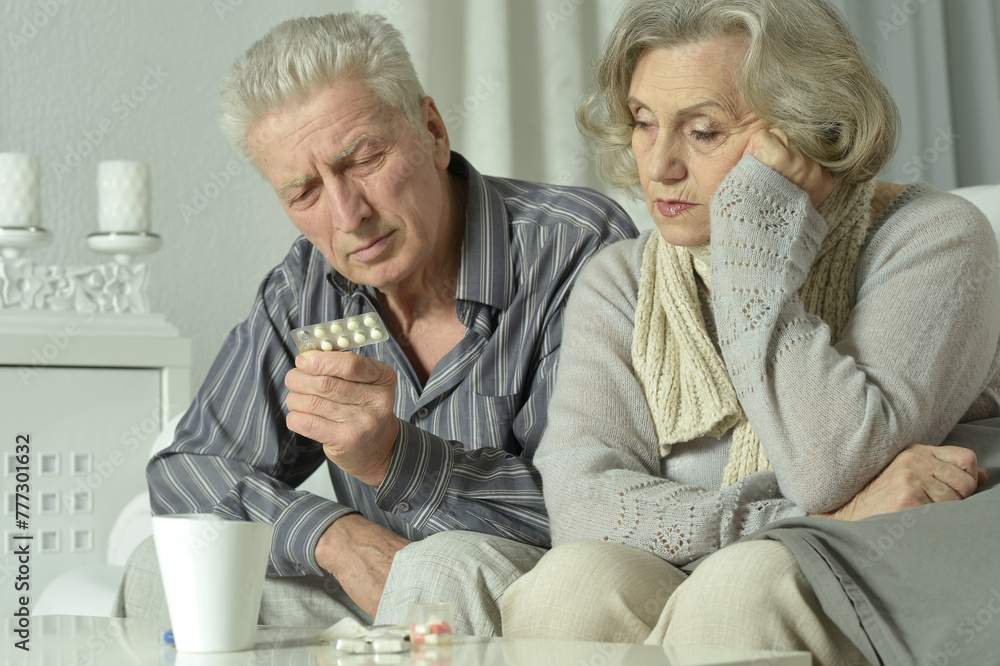 Close up portrait of sick senior man holding inhaler Close up portrait of sick senior man holding inhaler