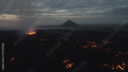 Aerial video of a volcanic eruption, lava and rivers, Litli Harut, Iceland photo