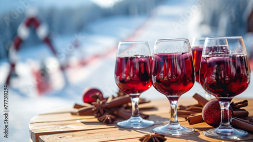 Cozy Mulled Wine with Cinnamon on Wooden Table Overlooking Snowy Slopes