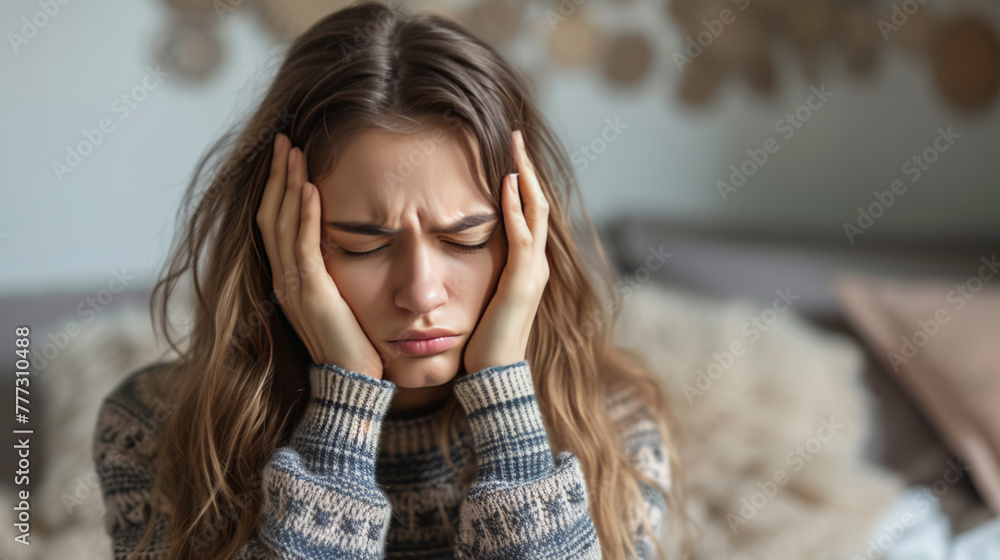 Young Woman with Hands on Temples Feeling Stressed or in Pain Young Woman with Hands on Temples Feeling Stressed or in Pain