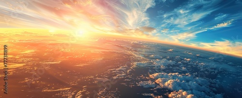 Breathtaking view of the Earth from the air: sunrise illuminating the clouds and ocean seen from the airplane window