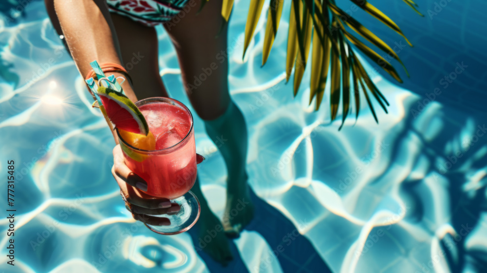 Obraz premium Colorful Tropical Cocktail by Poolside with Palm Shadow