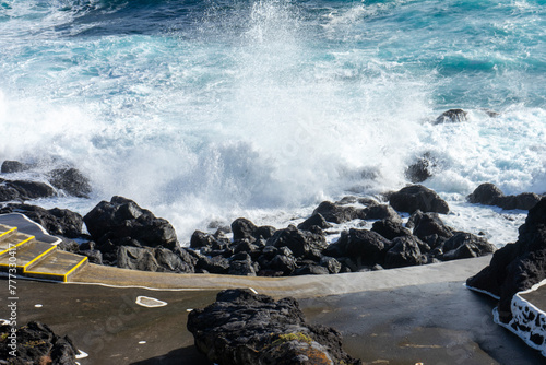 Powerful waves crash along the shoreline of Cinco Ribeiras, a scenic bathing area on Terceira Island, Azores.