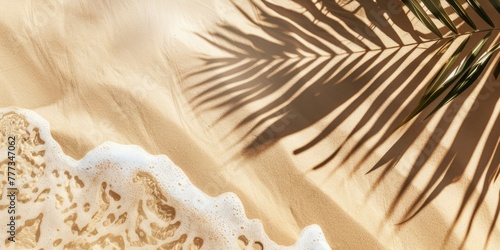 Beige sand background with palm leaf shadow and sea foam texture. summer beach concept, top view © Ahasanara