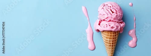 pink ice cream melting on blue background