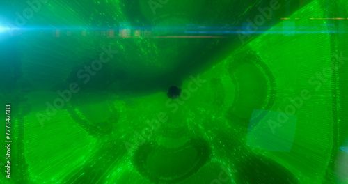 Fototapeta Naklejka Na Ścianę i Meble -  Green energy tunnel frame with futuristic electric field particles and lines of high-tech energy. Abstract background