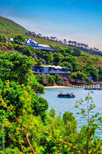 Featherbed Nature Reserve and aa boat in indian ocean at Knysna  Garden Route  South Africa