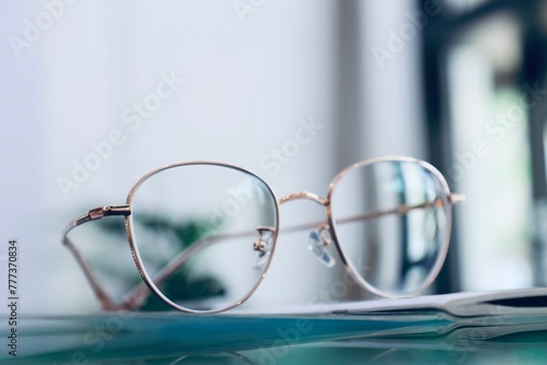 glasses on a table, Eyeglasses on table, progressive lenses, eyeglasses for the elderly, glasses progressive lens, eyeglass progressive lens, close-up of glasses on lenses test, looking through glasse