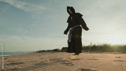 Monk Does Jump Rope Sport Training On The Sand Dunes