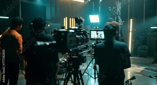 Film Crew Shooting Video Production in Studio with Lighting Equipment