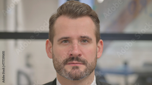Close up of Serious Face of Middle Aged Man