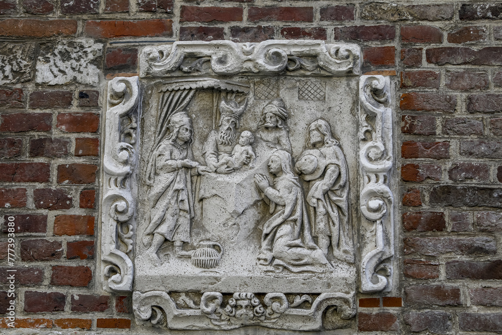 Christian relief on a wall in Le Beguinage, Leuwen, Belgium. Jesus’s circumcision Christian relief on a wall in Le Beguinage, Leuwen, Belgium. Jesus’s circumcision