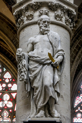 Saints Michael & Gudule cathedral, Brussels, Belgium..Saint Nathanael (Bartholomew) statue photo