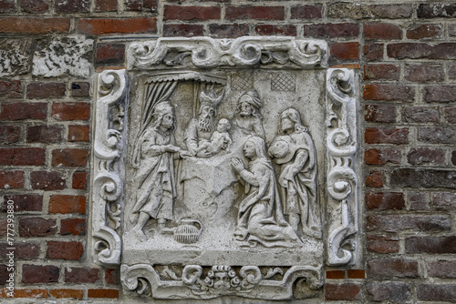 Christian relief on a wall in Le Beguinage, Leuwen, Belgium. Jesusâ€™s circumcision photo