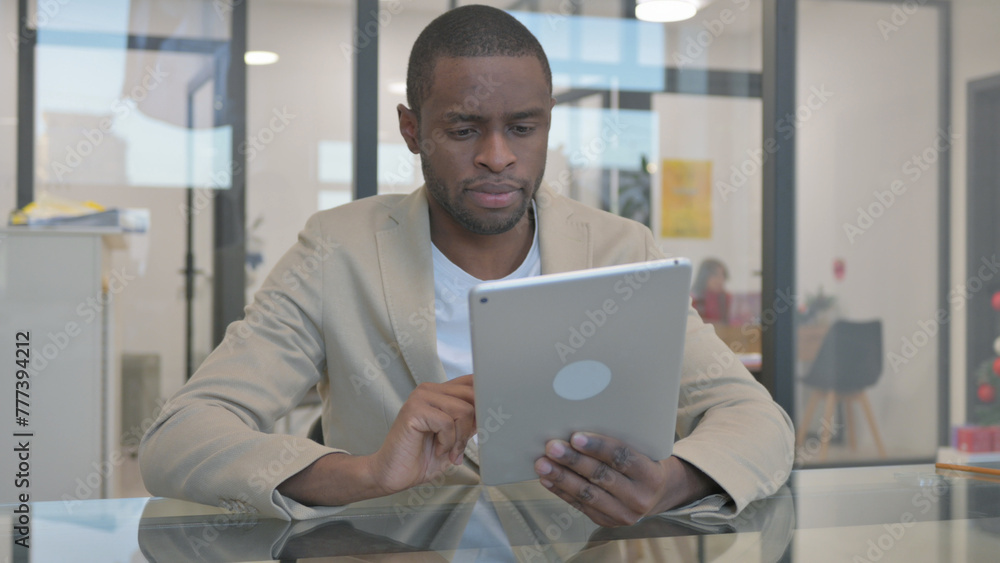 African Man Doing Video Talk on Digital Tablet in Office African Man Doing Video Talk on Digital Tablet in Office