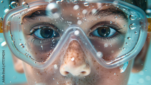 A child in swimming glasses swims underwater. ©   Vladimir M.