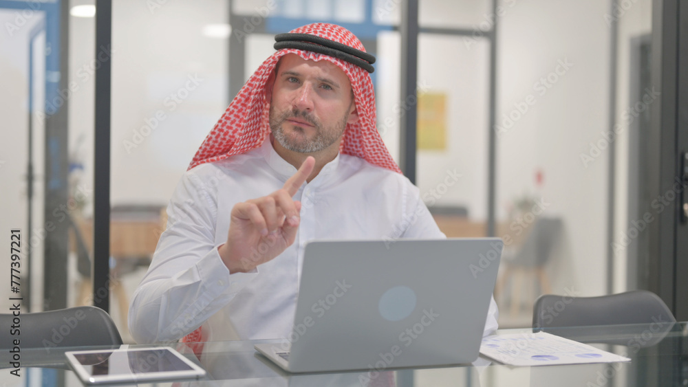 Rejecting Arab Man with Disliking Gesture at Work Rejecting Arab Man with Disliking Gesture at Work