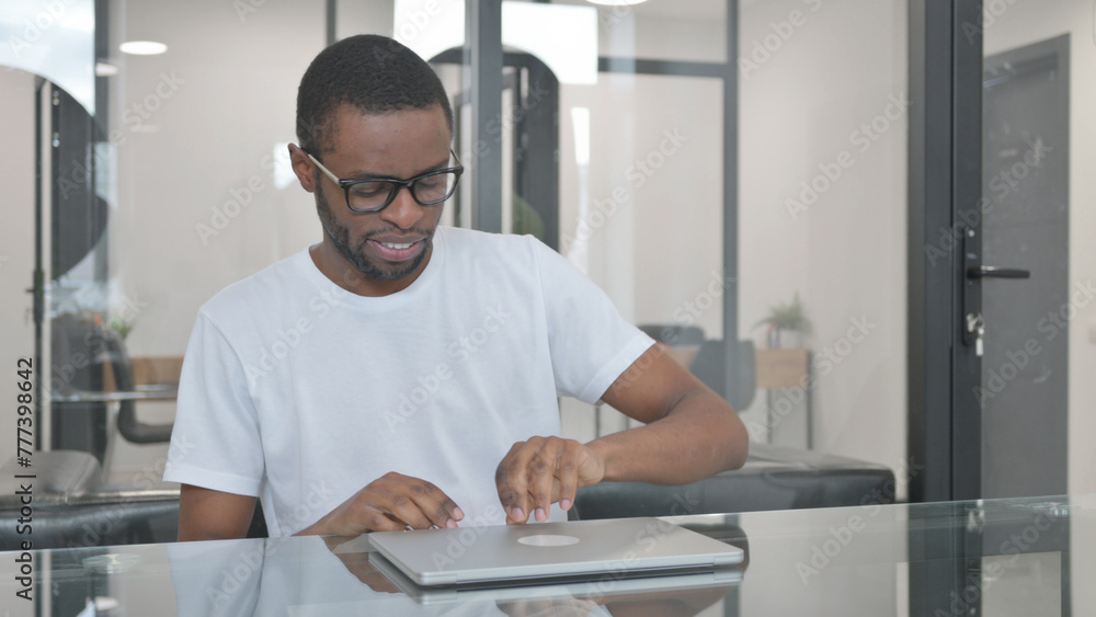 African Man Coming to Work on Laptop African Man Coming to Work on Laptop