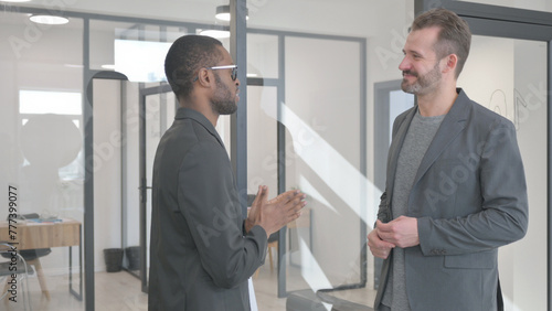 Hand Shake by Multi Ethnic People in Office