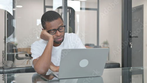 Tired Young African Man Sleeping in Office