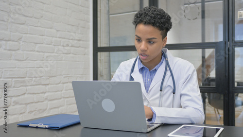 African Female Doctor Talking with Patient Video Conference
