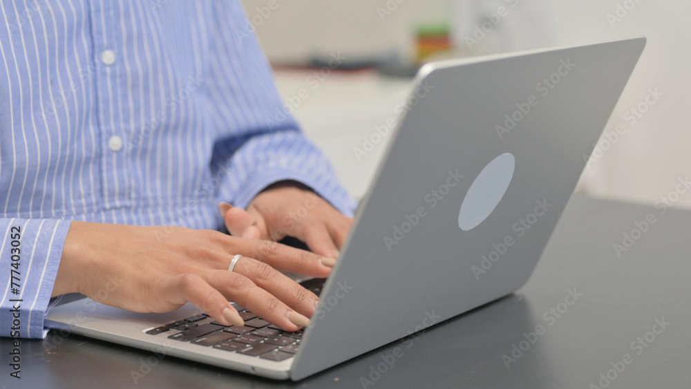 Fototapeta premium Close up of Female Hands Typing on Laptop