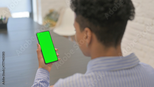 African Woman Using Green Screen Smartphone