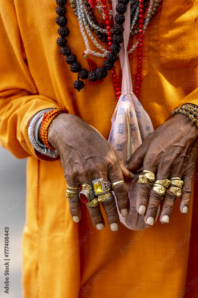 Sadhuâ€™s jeweled hands in Juhu, Mumbai, India.