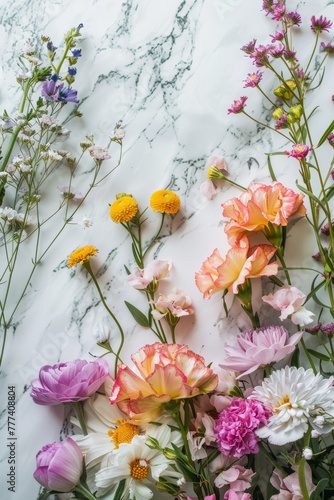 Realistic photo of colorful fresh flowers on a pastel marble backgound