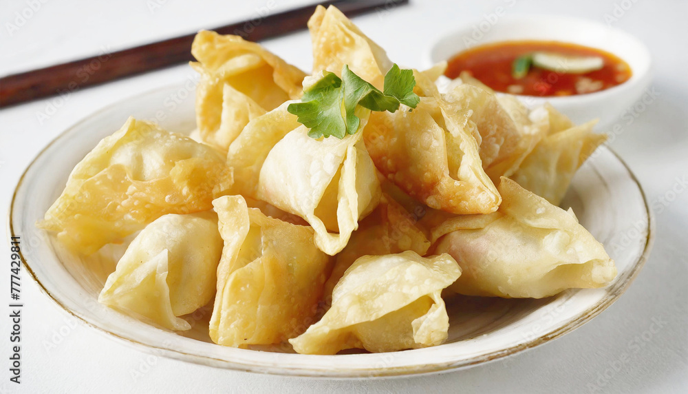 Chinese crab rangoon on a plate, closeup.