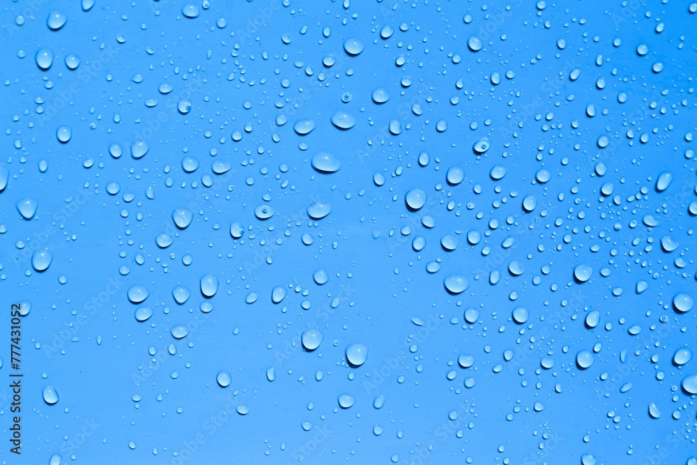 Realistic water drops on blue background or texture Realistic water drops on blue background or texture