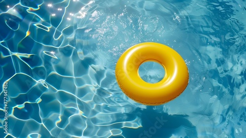 summer yellow swim ring in blue swimming pool